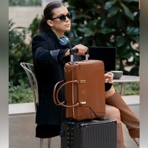 Never used beautiful leather La Mansio One bag with camera cube and three straps